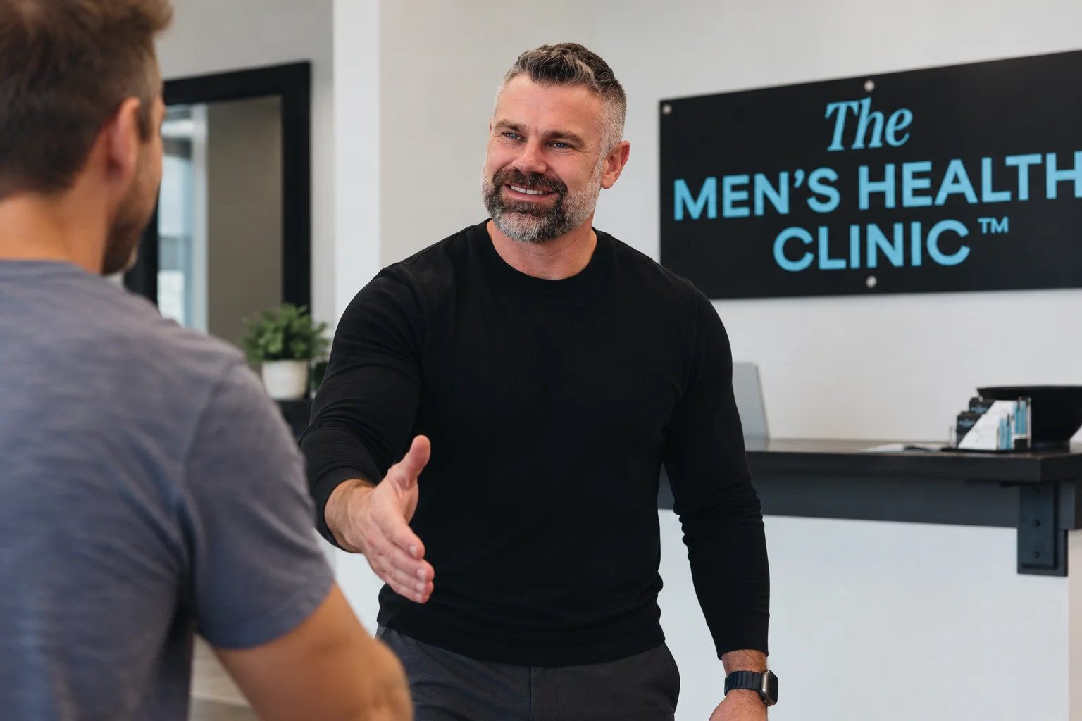 Erik welcoming a visitor to The Men's Health Clinic